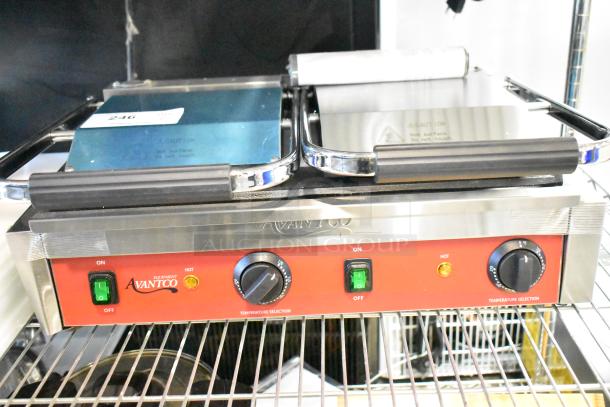 Brand new Avantco 177PG400S commercial dual panini grill with smooth plates, 19 5/8"x9 1/8" surface, 120V, 1 phase.