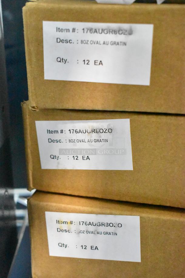 Four boxes of Choice 176AUGR8OZO, each with twelve 8 oz. stainless steel oval au gratin dishes, new condition, scratch and dent.