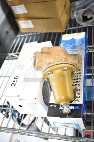 4 new scratch and dent items, including a Hatco 03.01.003.00 temp/pres gauge and Watts LF40XL, in original packaging.