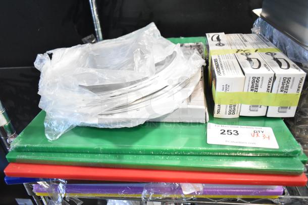 34 new scratch and dent items, including stainless steel bins, cutting boards, and Vollrath dishers. Auction lot 253.