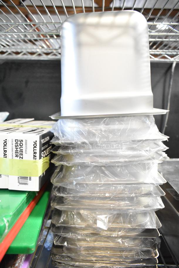 Stack of new stainless steel drop-in bins and Vollrath dishers. Includes cutting boards. Brand new, scratch and dent condition.