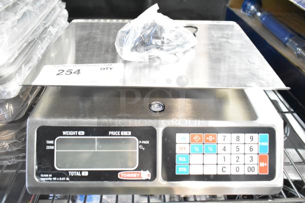 Brand new Torrey L-PC 40L 40 lb. digital price computing scale, legal for trade, with minor cosmetic scratches. 
