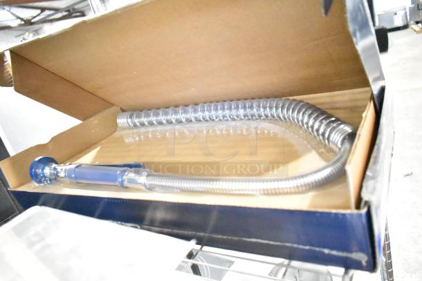 Brand new Waterloo 750PRD812 pre-rinse faucet with 8" centers, 12" add-on faucet, 1.15 GPM. Minor scratch and dent.