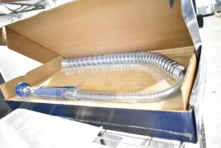 Brand new Waterloo 750PRD812 pre-rinse faucet with 8" centers, 12" add-on faucet, 1.15 GPM. Minor scratch and dent.