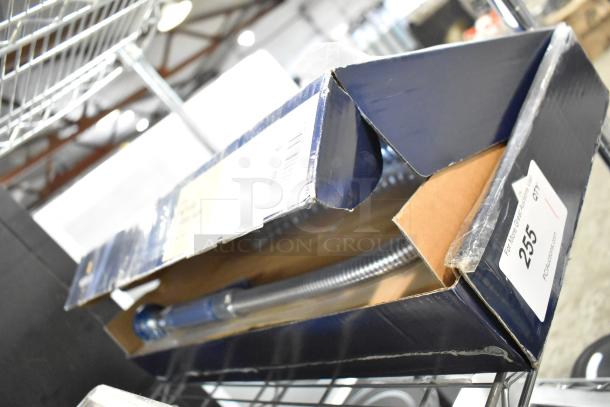 BRAND NEW SCRATCH AND DENT Waterloo 750PRD812 1.15 GPM deck-mounted pre-rinse faucet in opened box.