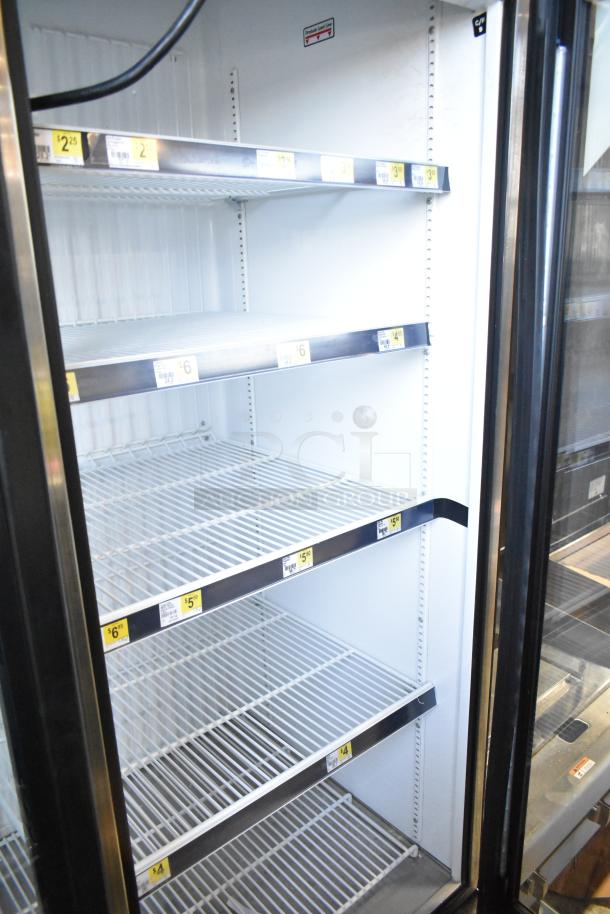 2019 True GDM-72F-HC 3-door reach-in freezer merchandiser, metal shelves, 115/208-230V, 1 phase, excellent condition.