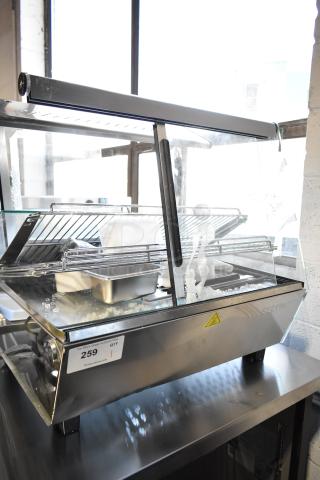 ServIt HDM-26 heated display case, 26", three shelves, sliding doors, visible scratches and dents, 120V, 1 phase.