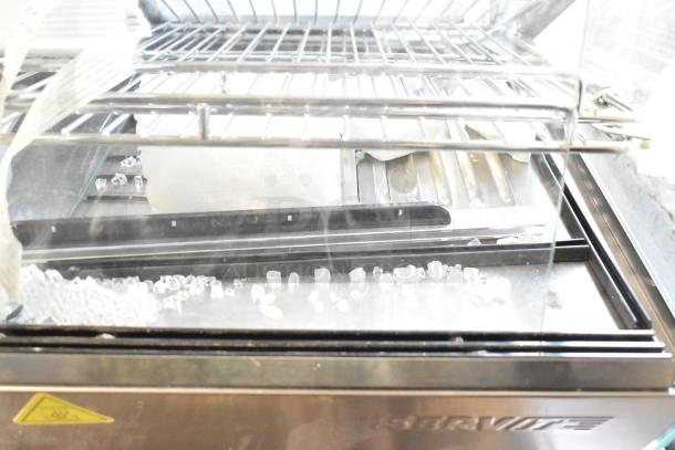 ServIt HDM-26 heated display case, 26", 3 shelf, sliding doors, scratch and dent condition, 120V, 1 phase.