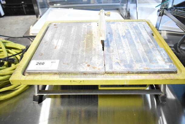 Ryobi countertop saw, 115 volts, 1 phase. Visible wear and rust. Auction label states "260 QTY".