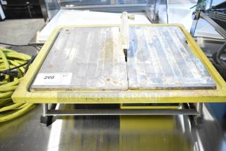 Ryobi countertop saw, 115 volts, 1 phase. Visible wear and rust. Auction label states "260 QTY".