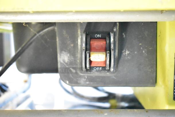 Ryobi countertop saw on/off switch detail. 115 volts, 1 phase. Visible dust, indicating use.