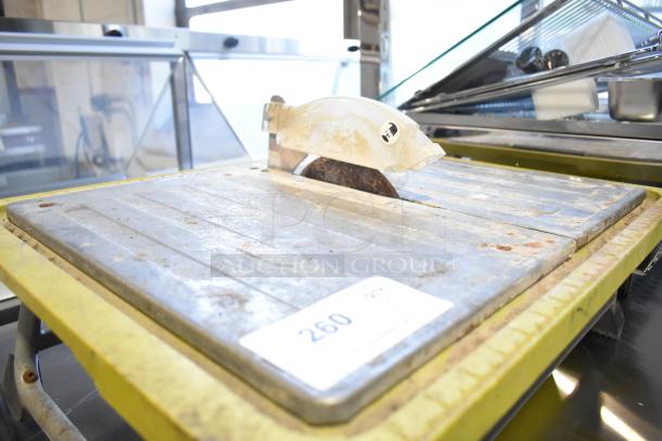 Ryobi countertop saw, used condition, 115 volts, 1 phase, visible wear, safety guard, item tag showing number 260.