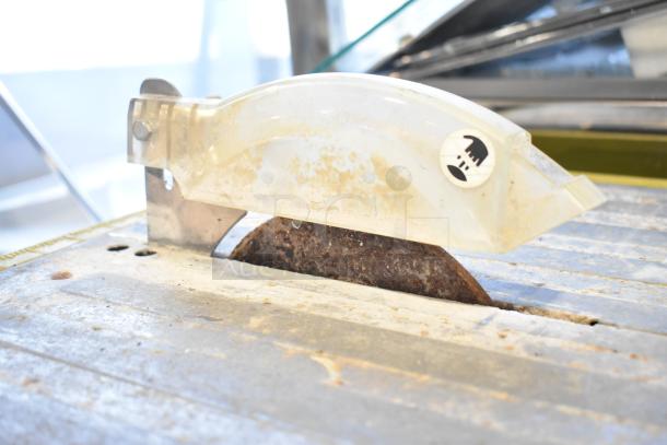 Ryobi Countertop Saw in used condition, visible rust on blade. Powered by 115 volts, 1 phase. Safety markings present.