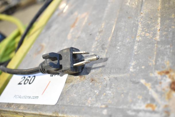 Ryobi Countertop Saw plug on metal surface, 115 Volts, 1 Phase, auction tag with number 260 visible. Used condition.