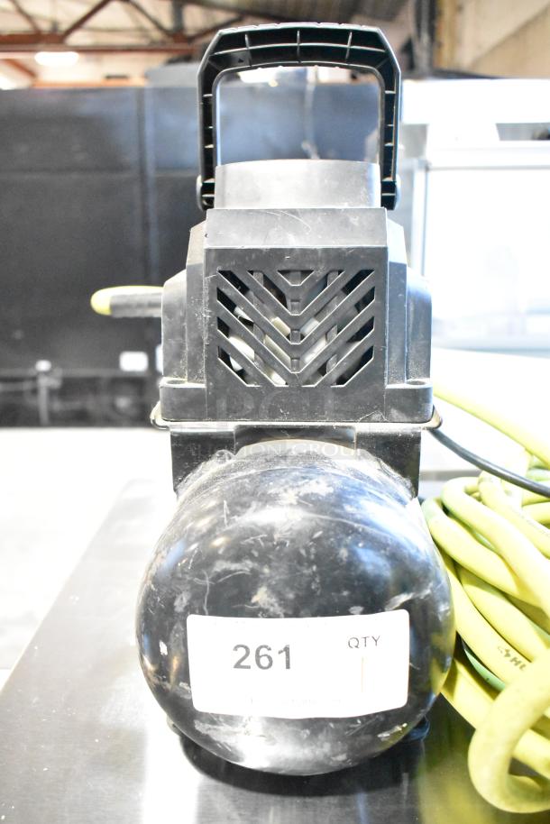 2016 Husky 0100211A Air Compressor by ServIt, features handle, attached hose, and visible label "261," in fair condition.