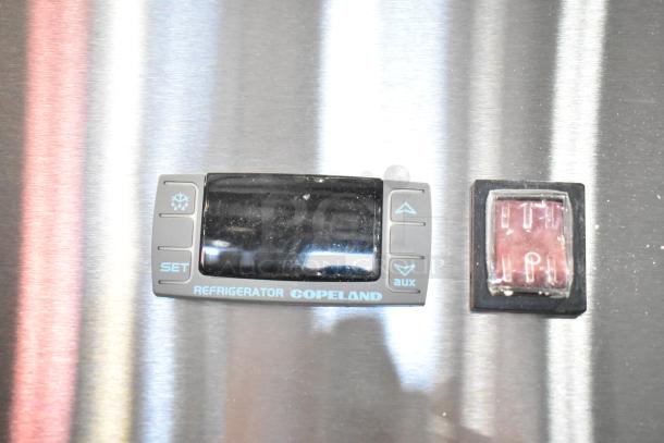Control panel of 2025 KoolMore RIR-3D-SS commercial refrigerator, showcasing temperature settings and Copeland branding.