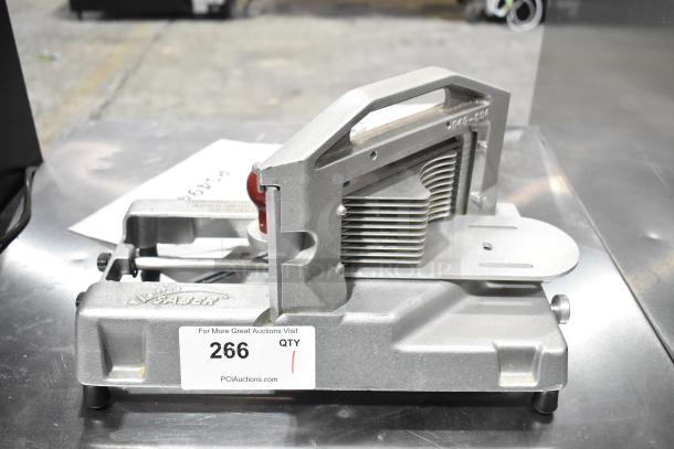 Tomato Saber countertop tomato slicer, metal construction, silver finish, visible blades, item tag "266" attached.