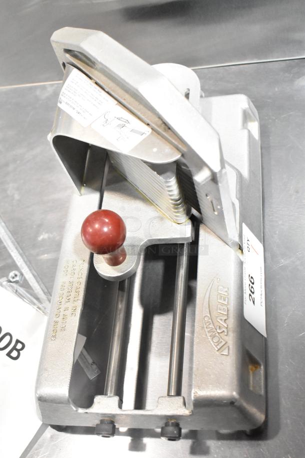 Tomato Saber Countertop Tomato Slicer, metal construction, wood handle, engraved branding, visible usage marks.