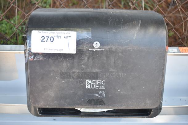 Georgia Pacific wall mount paper towel dispenser, black, used condition, visible logo and auction tag.