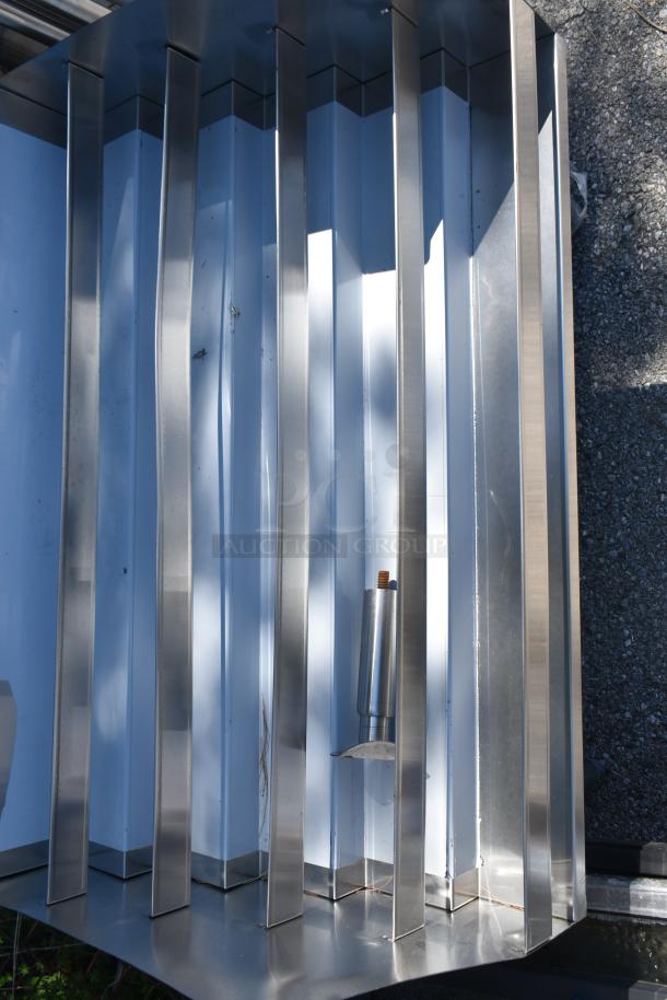 Brand new commercial bottle display rack with minor scratches and dents, featuring metal construction and multiple vertical slots.