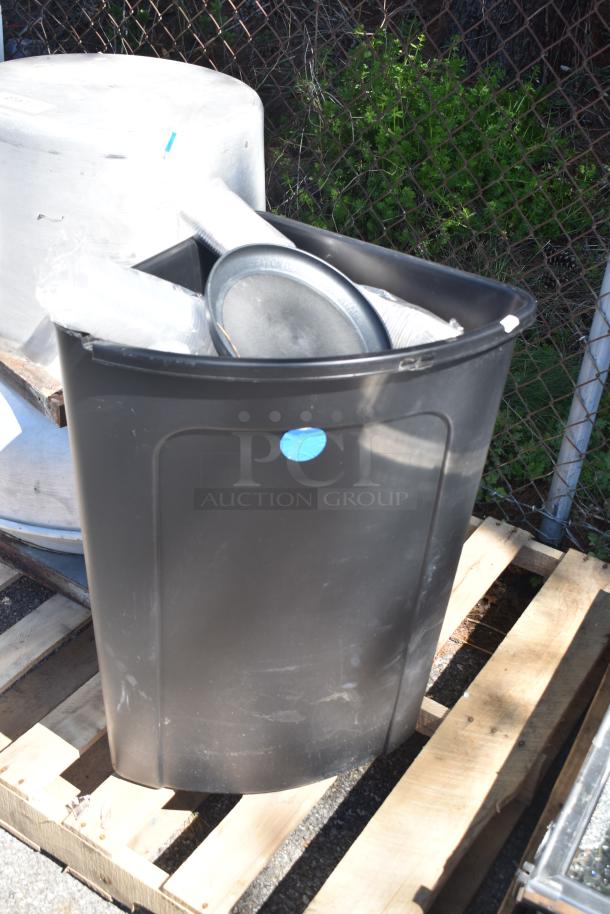 Rooftop mushroom exhaust fan and black poly trash can on wooden pallets, items offer twice your bid value.
