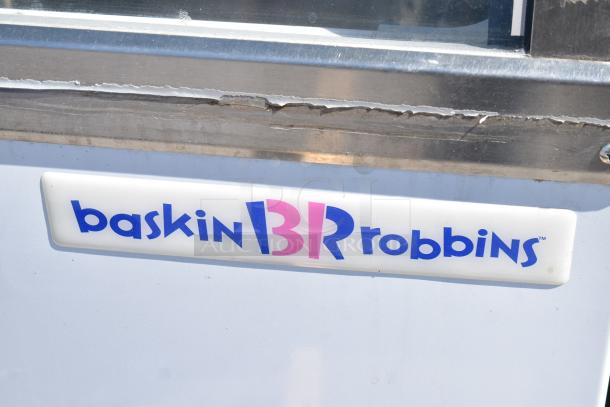 Commercial floor style ice cream dipping cabinet, 115 volts, 1 phase, with visible Baskin Robbins logo, moderate wear.