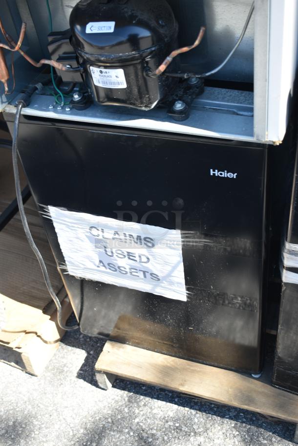 Six various mini coolers, including Galanz GLR31TS1E02 and Haier brand, 115 volts, 1 phase, labeled "CLAIMS USED ASSETS".