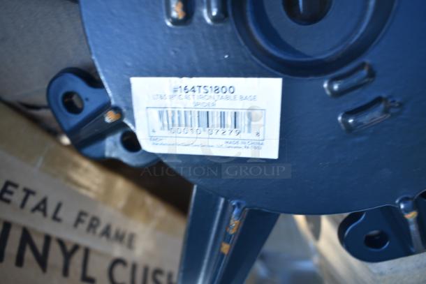 Cast iron table base spider labeled "164TS1200," part of a mixed auction lot. Box indicates chair cushions.