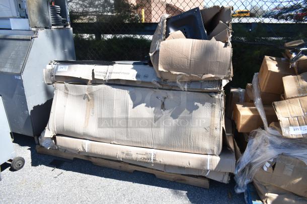 Six brand new items include carts, equipment stand, and security cage. Visible scratch and dent on packaging.