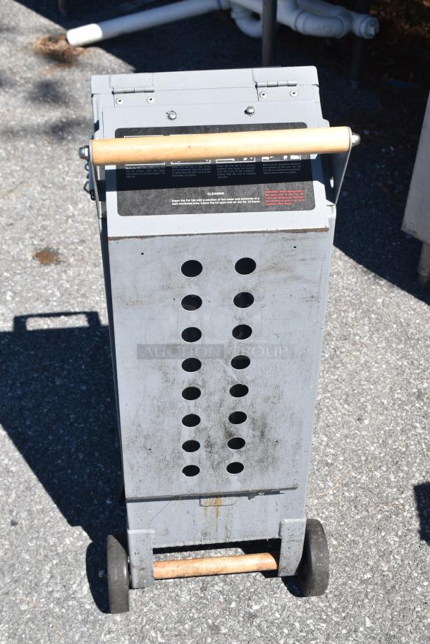 Brand new Pitco® D9109105 FAT VAT 40 lb. waste oil transport container with minor scratches and dents, visible handle and wheels.