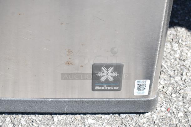 Manitowoc QY1305W Commercial Ice Head on Ice Bin, 208-230V, 1 Phase. Features Manitowoc logo and QR code label.