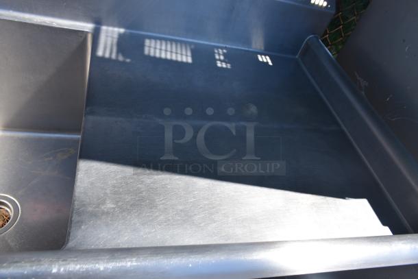 Duke Commercial 3 Bay Sink with dual drain boards, stainless steel, used condition, visible drain.