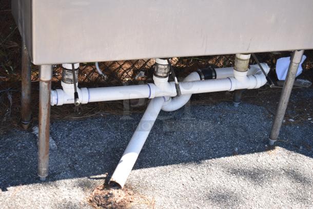 Duke Commercial 3 Bay Sink with dual drain boards, featuring visible plumbing and sturdy metal legs. Suitable for heavy-duty use.