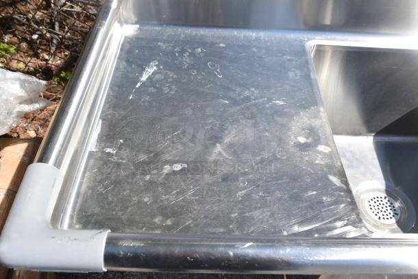 Commercial 3 Bay Sink with dual drain boards, stainless steel, lightly scratched surface, ideal for high-volume use.