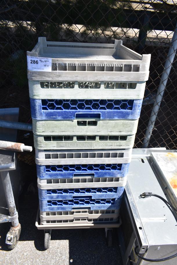 Lot of 12 poly dish caddies stacked on a dish caddy dolly with commercial casters. Visible label: "286 QTY 1X13".