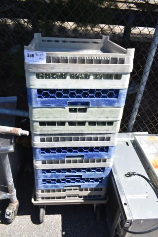 Lot of 12 poly dish caddies stacked on a dish caddy dolly with commercial casters. Visible label: "286 QTY 1X13".