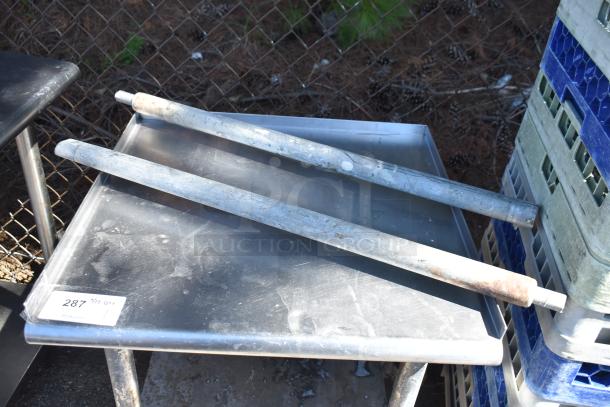 Commercial equipment stand with under shelf, on casters, metal finish, used condition, auction lot tag visible.