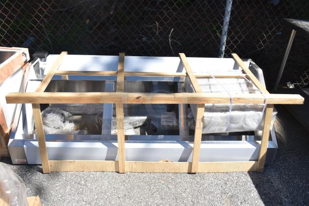 Brand new Vevor commercial hood, scratch and dent condition, in wooden crate with packaging materials visible.