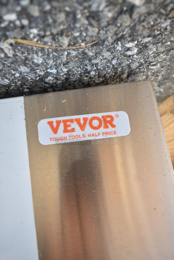 Vevor Commercial Hood with "Tough Tools, Half Price" label, new with minor scratches and dents, stainless steel finish.