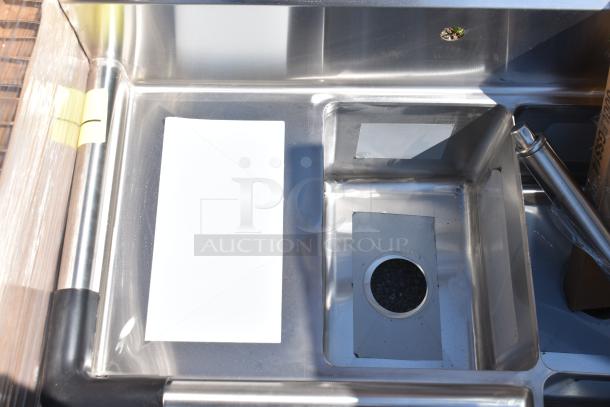 Brand new Regency 600S3101410C 39" stainless steel corner sink with three 10"x14"x10" compartments, two drainboards.