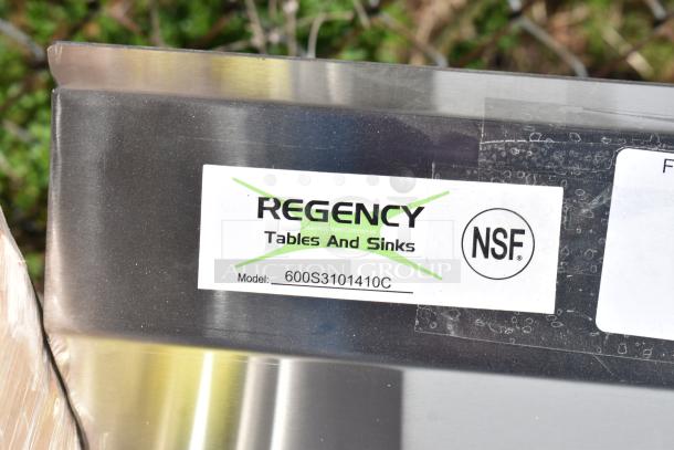"Regency 600S3101410C stainless steel three-compartment corner sink with 2 drainboards and NSF label, no legs."