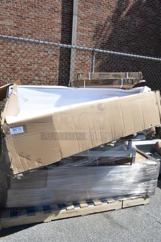 11 new scratch and dent items including wire shelves and work table on pallet; visible Regency label, damaged packaging.