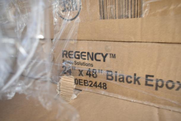 Cardboard box labeled "Regency Space Solutions, 24 x 48 Black Epoxy," part of a new scratch and dent auction set.