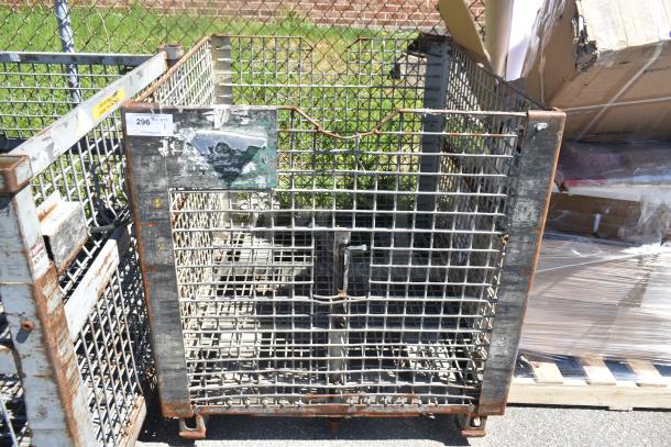Wire cage with a metal grid frame, rust spots, and a partially visible label numbered "296". Used condition.
