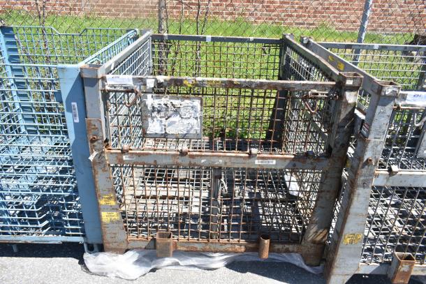 Heavy-duty wire cage with rust and wear, metal construction, visible labels with various codes, suitable for industrial storage.