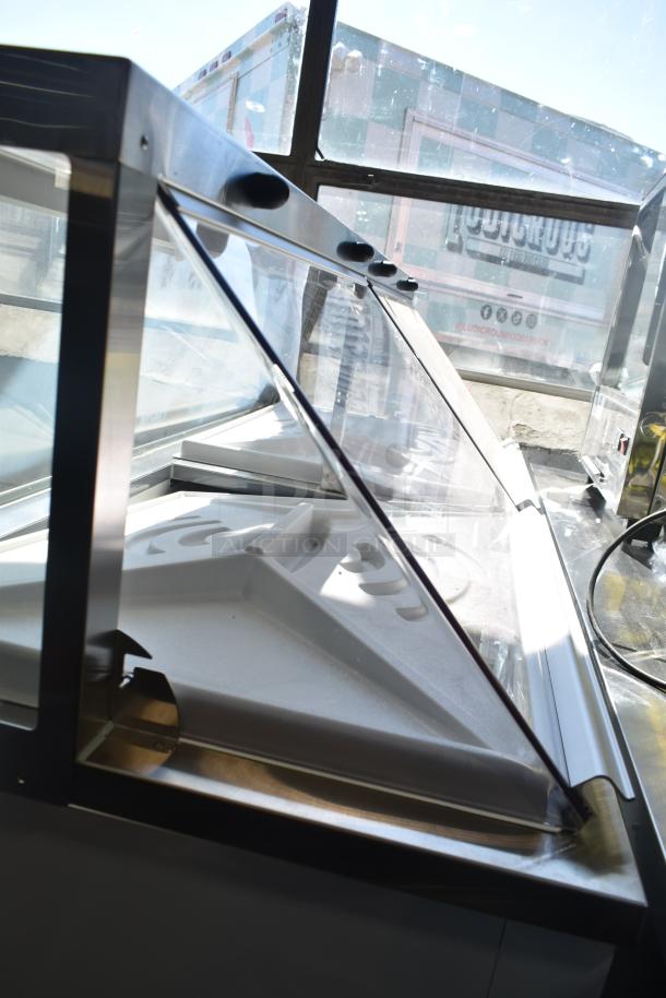 Avantco 178CPW68HC Commercial Ice Cream Dipping Cabinet, 67 3/4", 12 tubs, white, 115V, with clear curved glass top.