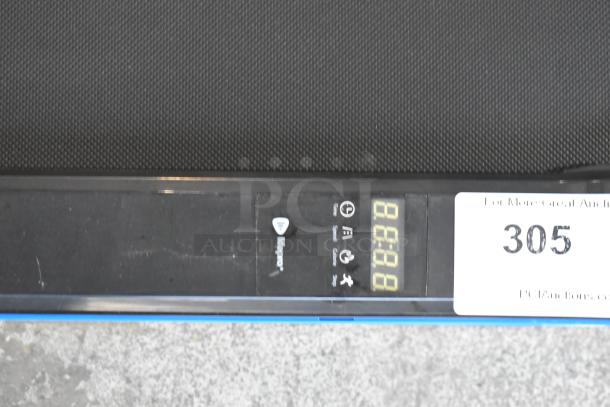 LifePro LP-PCRM-BLU PacerMini portable treadmill with LED display. Black frame, 110 volts, 1 phase. Auction label visible.