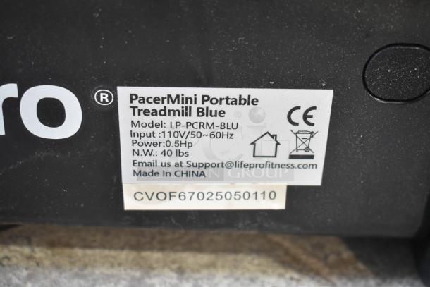 LifePro LP-PCRM-BLU PacerMini Portable Treadmill label. Specs: 110V, 0.5HP. Weight: 40 lbs. Made in China.