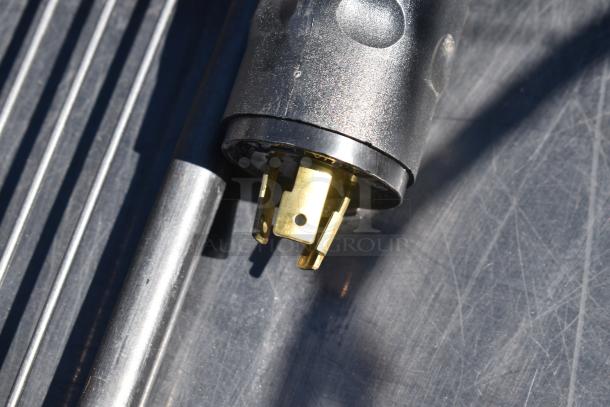 Hussmann Commercial Grab N Go Merchandiser plug detail, 115/208-230V, 1 Phase, showing sturdy construction and condition.