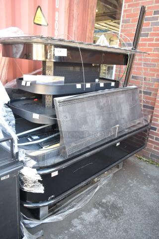 Commercial Island Style Grab N Go Merchandiser, black, metal construction, multiple shelves, used condition, some packaging cover.